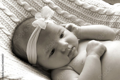 Photo: a baby girl with ribbon band. a baby girl with ribbon band.