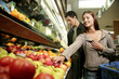 A couple shopping for fruits.
