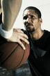 A man stopping his opponent from passing the ball.