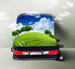 Red suitcase with green nature inside