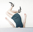 Photo: A lady in a dress and high heels with her head stucked inside and her body upside down. A lady in a dress and high heels with her head stucked inside and her body upside down.