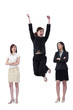 A lady jumping up in joy while her two friends watching with envy.