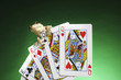 A frog and playing cards.
