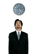 Man in business suit looking at the clock. 