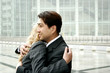 A man and a woman in business suits hugging. 