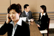 A woman talking on the handphone.