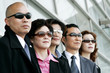 Business people wearing sunglasses. 