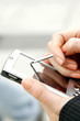 Photo: Hands using palmtop. Hands using palmtop.