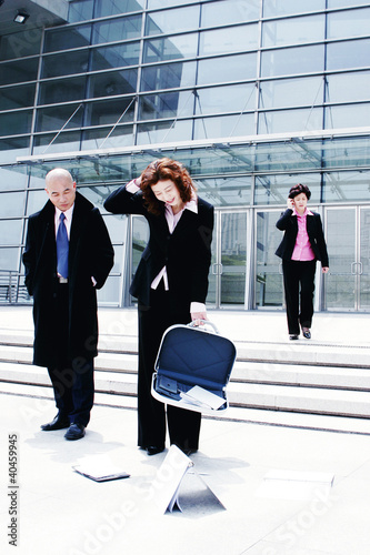Photo: Things dropping out from an unlocked briefcase. Things dropping out from an unlocked briefcase.