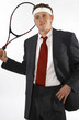 Businessman holding a tennis racquet. 