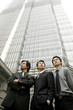 Foto: Three businessmen standing in front of the building. Three businessmen standing in front of the building.
