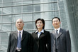 Businessmen and woman standing in a row. 