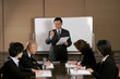 Man and women writing down what their manager explained. 