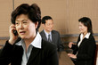 Business woman talking on the handphone. 