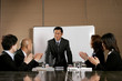Business man and women clapping their hands after a good presentation. 