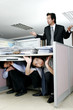 Two men hiding from their manager. 