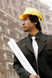 Photo: An architect standing at the construction site. An architect standing at the construction site.