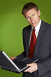 Businessman holding a laptop. 