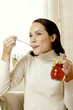 Woman eating honey.