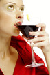 Woman drinking a glass of red wine.