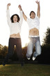 Couple jumping up with joy.