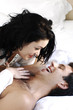 Photo: Couple in bed. Couple in bed.