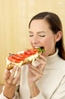 Woman eating a specially made croissant.