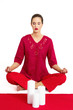 Woman in red meditating.
