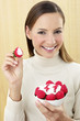 Woman holding a bowl of strawberries.