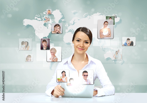 Photo: Business person against technology background Business person against technology background