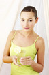 Photo: Woman holding a glass of lemonade. Woman holding a glass of lemonade.
