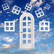 White door against blue sky background White door against blue sky background