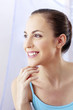 Photo: Woman flashing a bright smile. Woman flashing a bright smile.