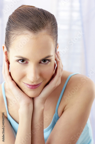 Photo: Woman flashing a smile at the camera. Woman flashing a smile at the camera.