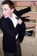 Businessman stealing stationery from his office.