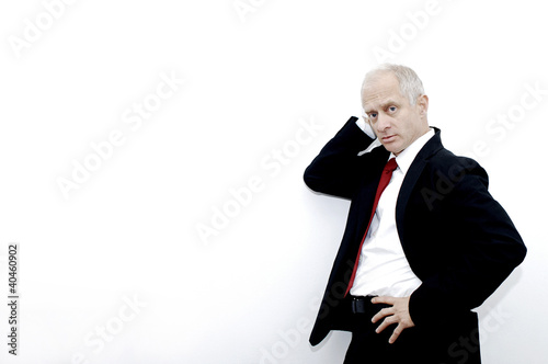 Photo: Businessman posing for the camera. Businessman posing for the camera.