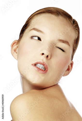 Photo: Woman winking her eye. Woman winking her eye.