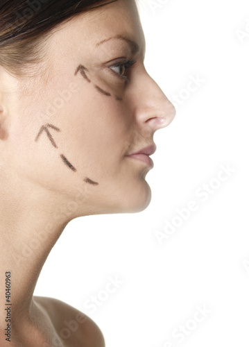 Photo: Woman's face with arrows showing up. Woman's face with arrows showing up.