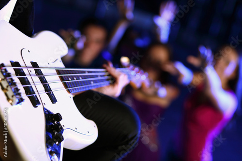 Photo: Young guitar player performing in night club Young guitar player performing in night club