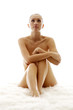 Naked woman sitting.