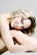 Foto: Naked woman smiling at the camera. Naked woman smiling at the camera.