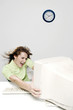 Businesswoman being blown away by a computer desktop.