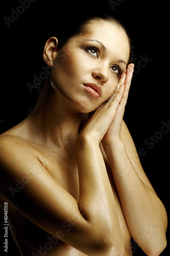 Photo: Topless woman resting on her hands. Topless woman resting on her hands.