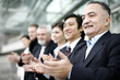 Corporate people clapping hands.