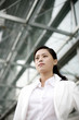 Businesswoman staring blankly at a space.