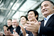 Corporate people clapping hands.