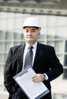 Senior businessman wearing a safety helmet.