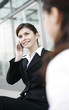 Businesswoman talking on the handphone.