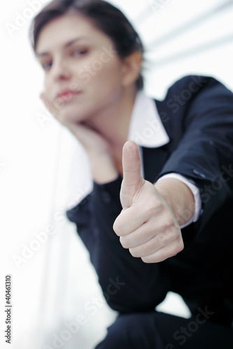 Photo: Businesswoman showing thumb up. Businesswoman showing thumb up.