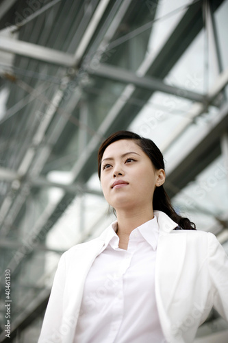 Photo: Businesswoman staring blankly at a space. Businesswoman staring blankly at a space.
